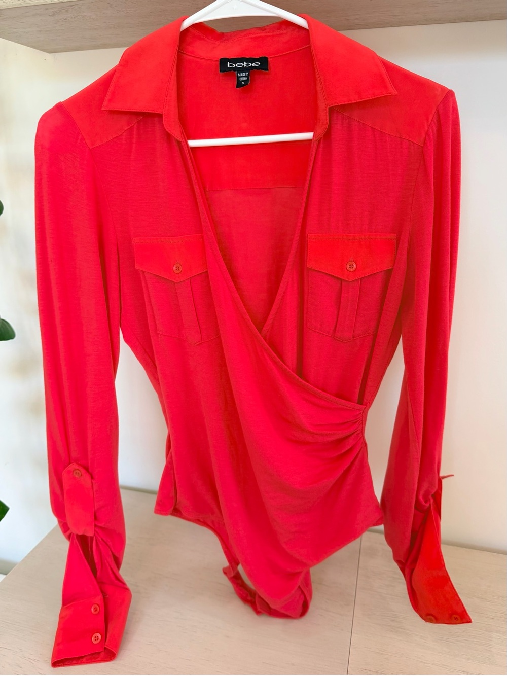 bebe Coral Wrap-Front Long Sleeve Bodysuit
